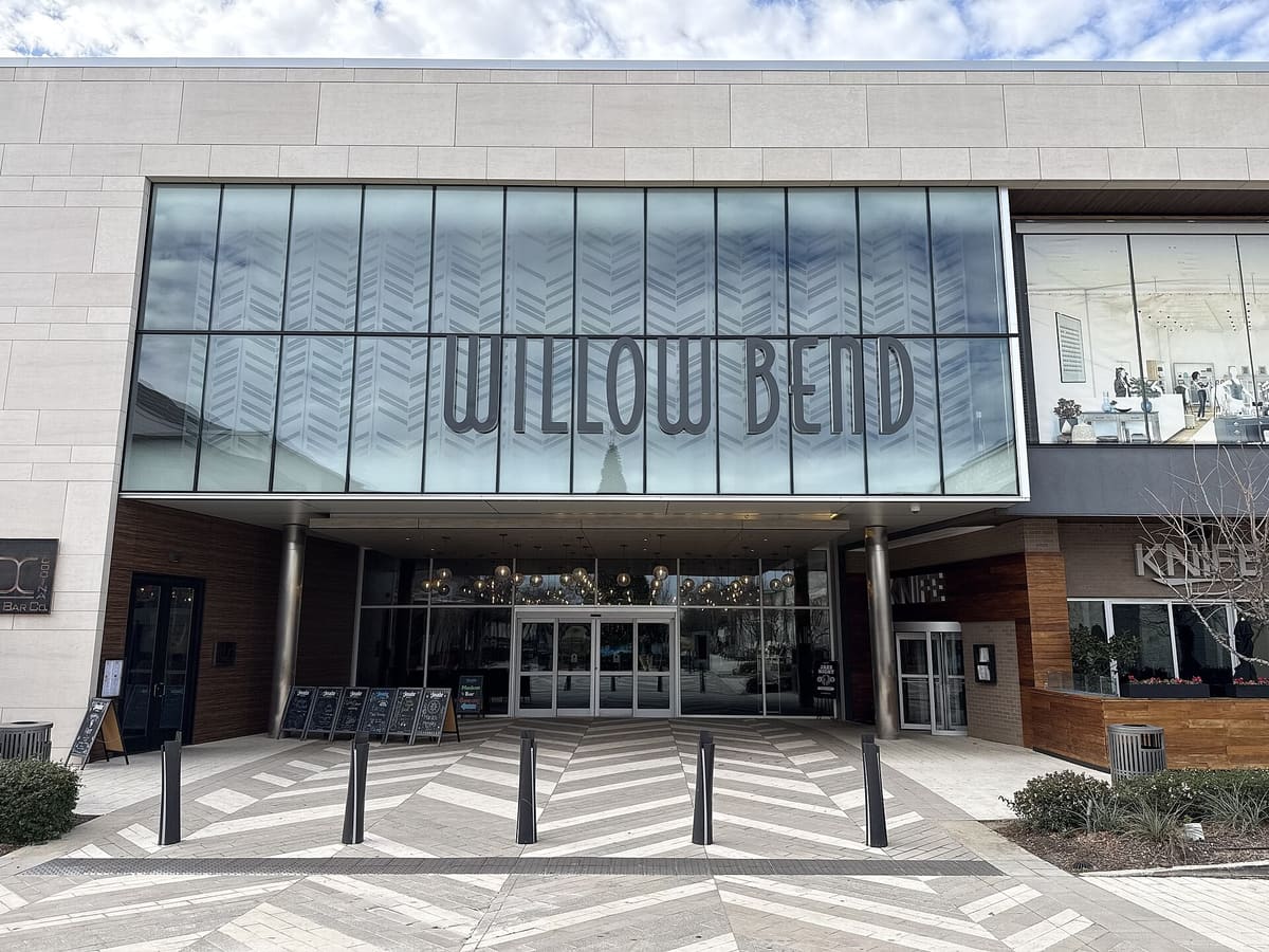 The glass entrance and Willow Bend lettering at The Shops at Willow Bend mall in Plano