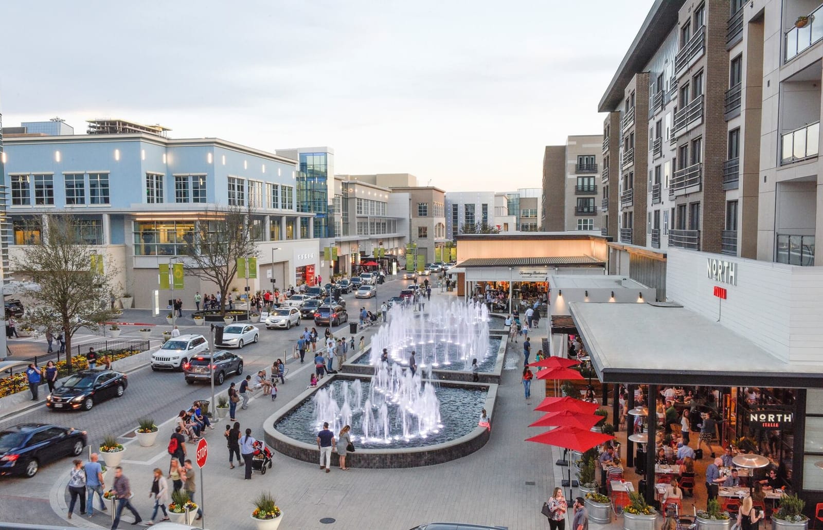 Fountains and restaurant patios at Legacy West in Plano, with apartments above street-level shops