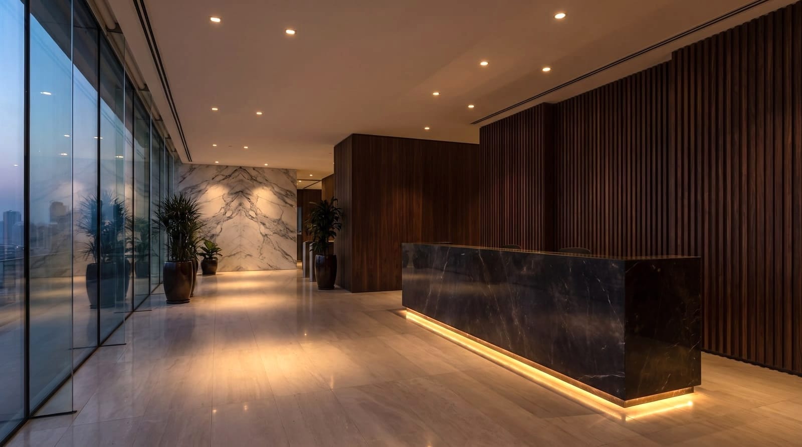 Commercial lobby with a black marble reception desk, walnut slat walls, and warm lighting