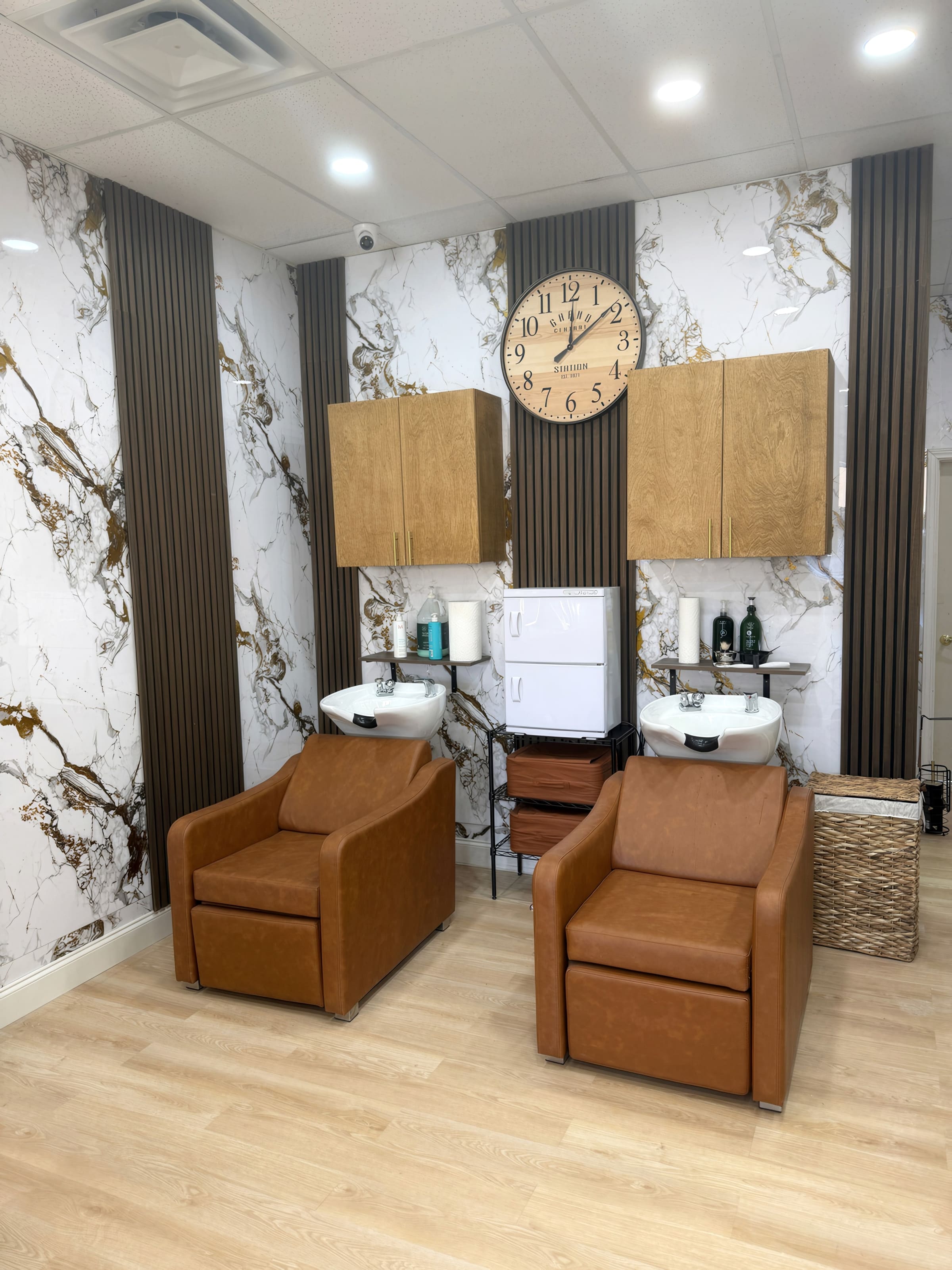 Waiting area with leather seating against the feature wall.